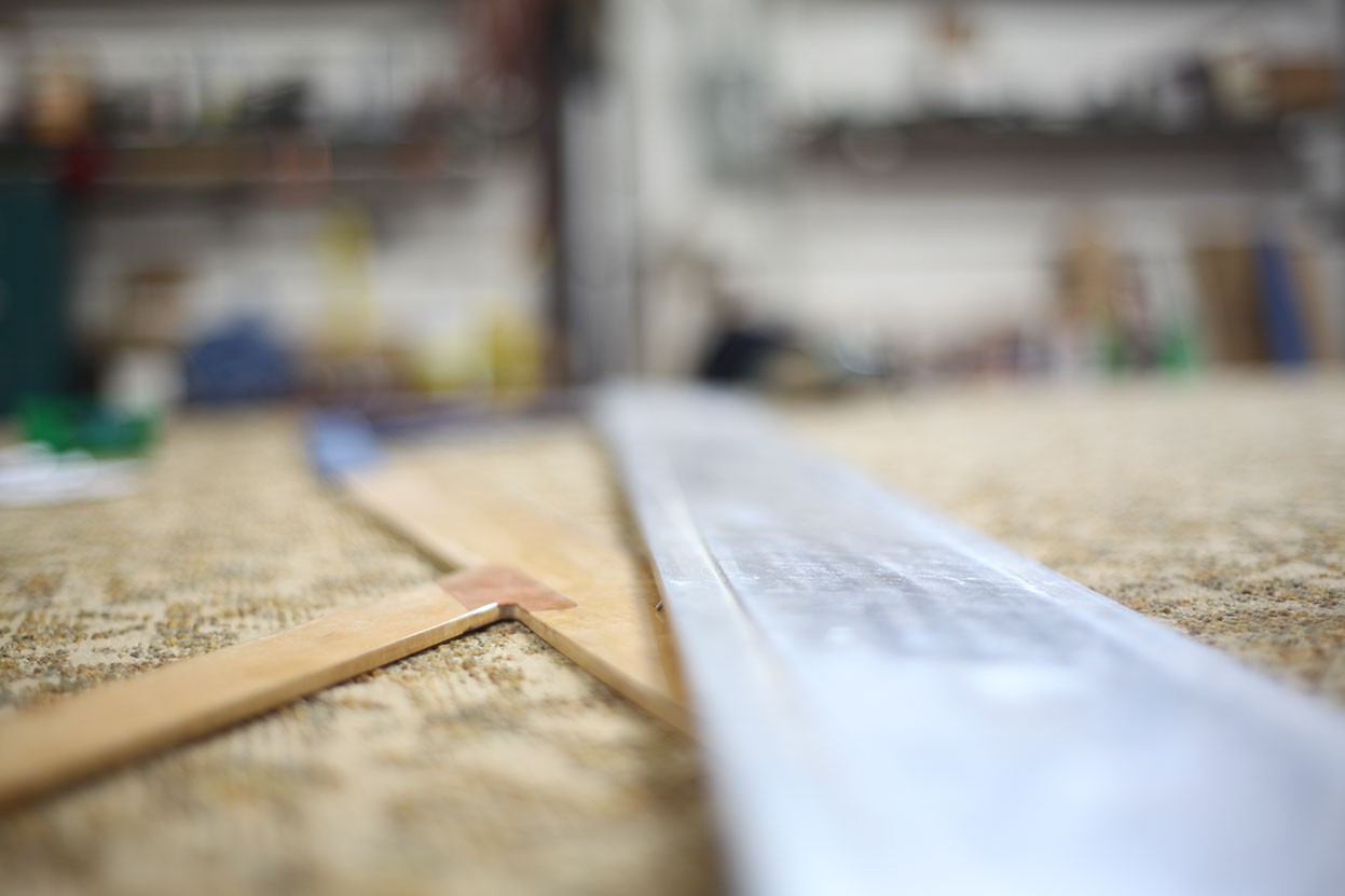 A photo of a drafting table in the workshop of the commercial division of Jackson Glass Works